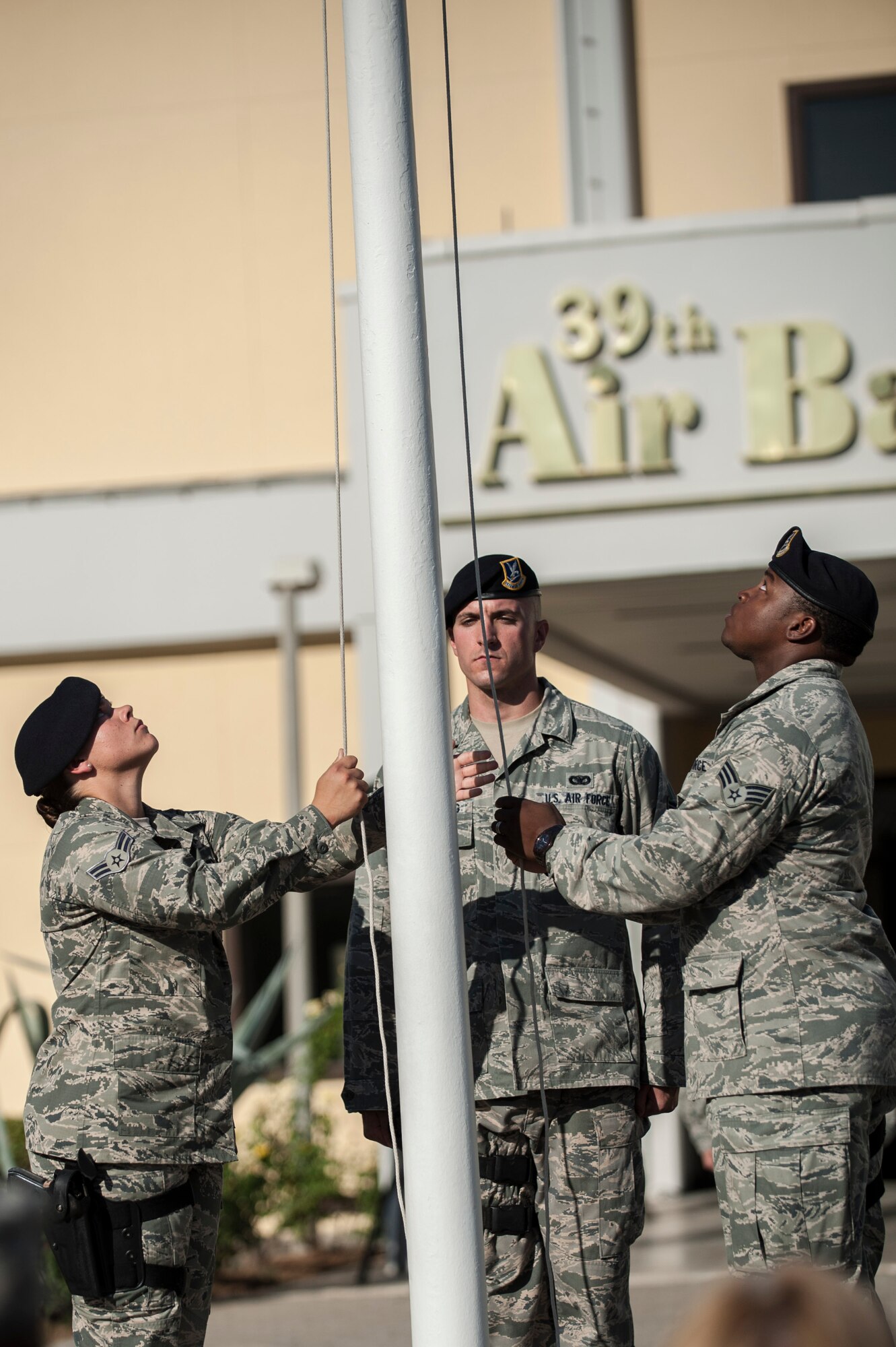 Airmen of Team Incirlik lower the flag during the 9/11 Retreat Ceremony Sept. 11, 2013, at Incirlik Air Base, Turkey. The event was held in honor of those who lost their lives during the terrorist attacks on 9/11. (U.S. Air Force photo by Airman 1st Class Nicole Sikorski/Released)