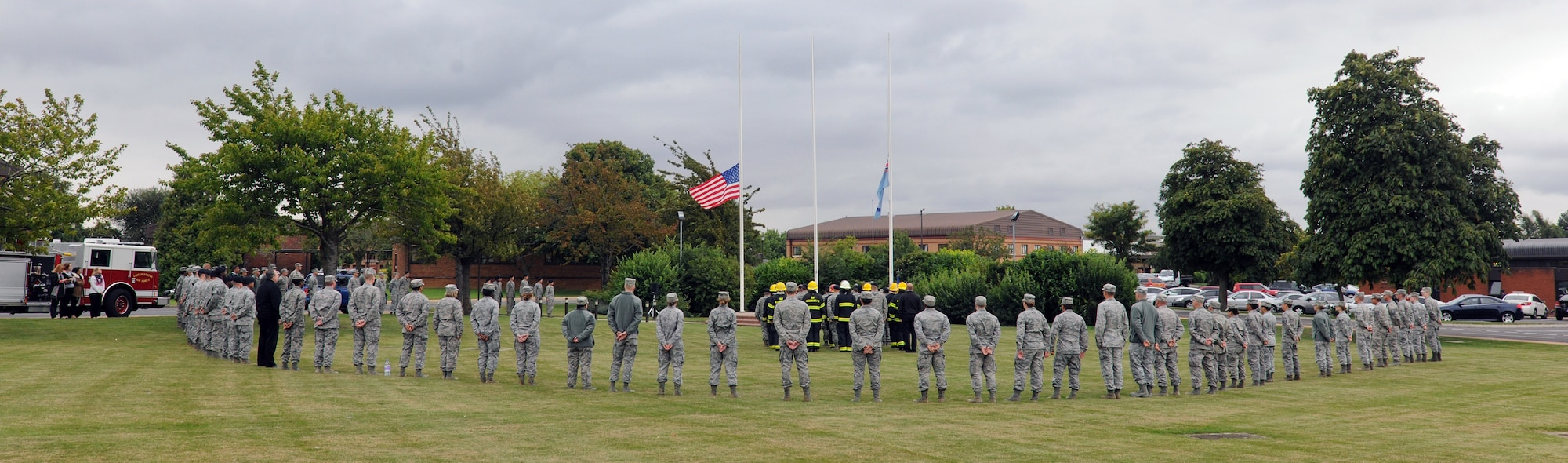 RAF ALCONBURY, United Kingdom – Members of the 501st Combat Support Wing prepare for a retreat ceremony at the Alconbury flagpole Sept. 11. The retreat was held in remembrance of the 9/11 attacks and the day marked the twelfth anniversary of the attacks. (U.S. Air Force photo by Staff Sgt. Brian Stives)