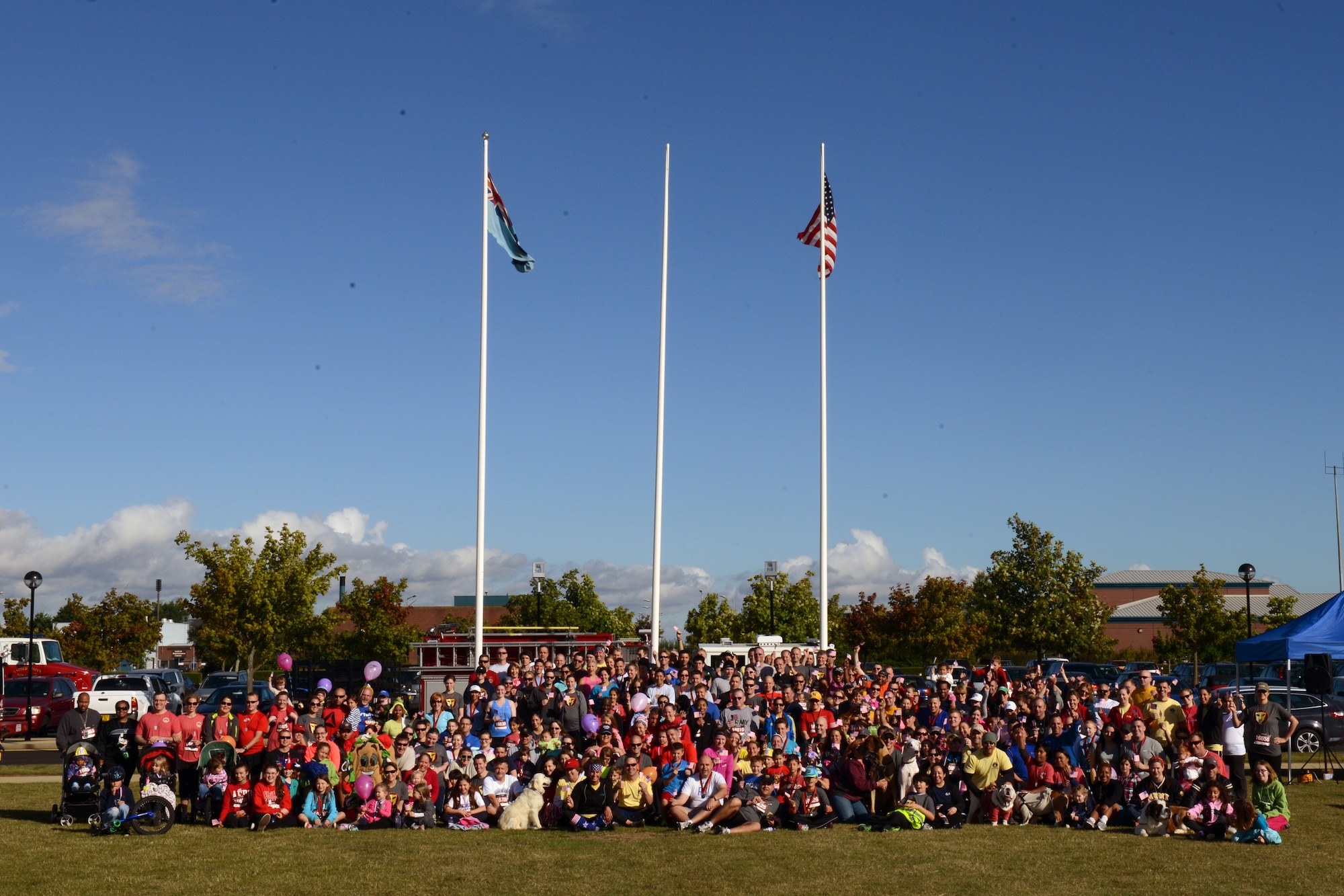 RAF MOLESWORTH, United Kingdom – Participants in the Heroes 9/11 Run/Walk pose for a group photo before stating their event Sept. 7. The event was held at RAF Molesworth and the money raised was donated to local charities in the United Kingdom. (U.S. Air Force photo by Tech. Sgt. Chrissy Best)