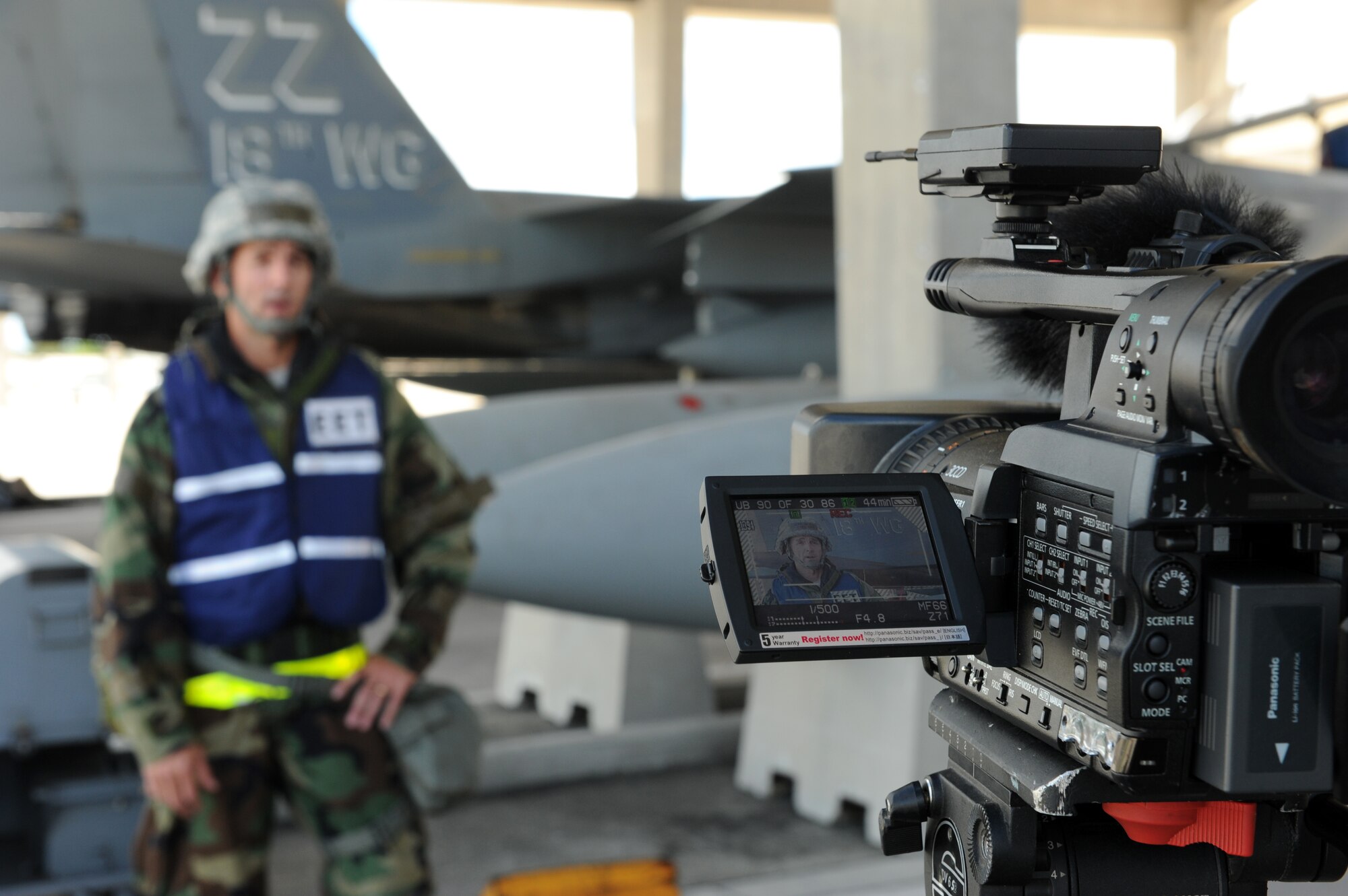 U.S. Air Force Lt. Col. Chad Cook, 18th Wing chief of plans and programs, is interviewed during a local operational readiness exercise on Kadena Air Base, Japan, Sept. 12, 2013. During Phase Two of the LORE 18th Wing Airmen participated in simulated missile and chemical agent attacks in order to prepare them for real world contingencies at a moment’s notice. (U.S. Air Force photo by Airman 1st Class Hailey R. Davis)