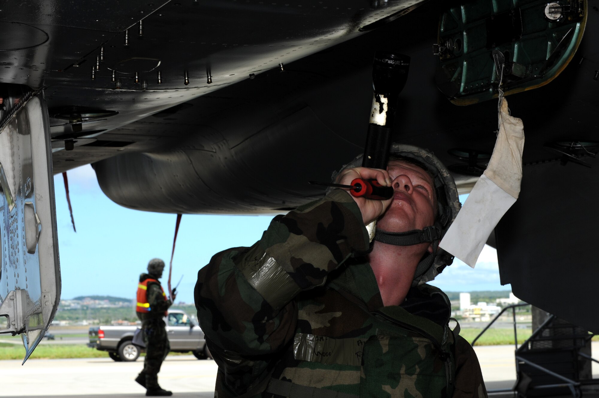 U.S. Air Force Airman 1st Class Race Wood, 44th Aircraft Maintenance Unit crew chief, inspects a utility reservoir under an F-15 Eagle during a local operational readiness exercise on Kadena Air Base, Japan, Sept. 12, 2013. The F-15 is an all-weather, extremely maneuverable, tactical fighter used by the Air Force to gain and maintain air supremacy over the battlefield. (U.S. Air Force photo by Airman 1st Class Hailey R. Davis)