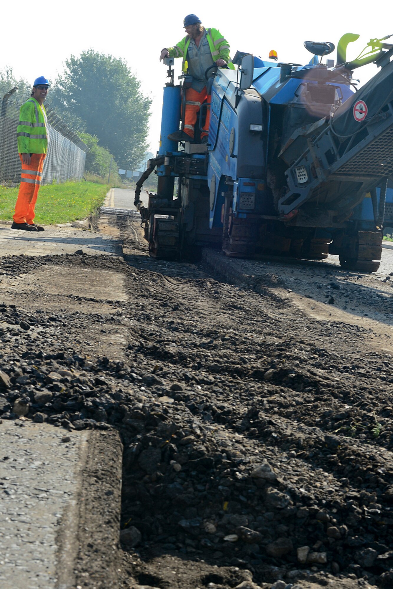 Construction workers with Volker Fitzpatrick expand Lords Walk Road by nine feet on Royal Air Force Lakenheath, England, Aug. 29, 2013. Base agencies have put together an Area Development Plan to increase safety and improve the quality of life for base residents. The projects include installing walkways between the housing and community areas and adding denial barriers, higher curbing and other force protection measures around Gate 2. (U.S Air Force photo by Airman 1st Class Dana J. Butler/Released) 