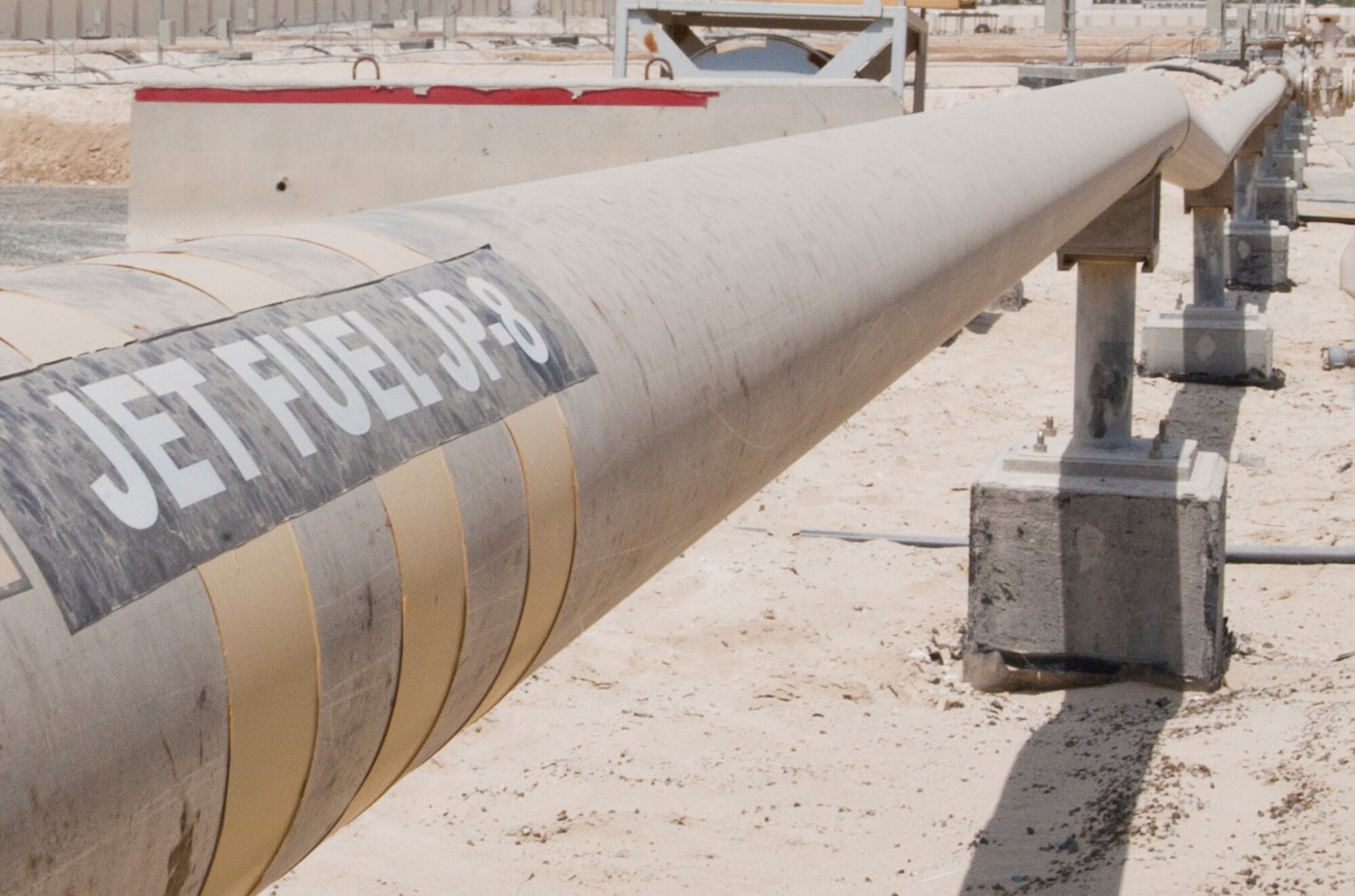 One of many pipes carrying fuel stored at the largest contingency fuels storage area in the Air Force. The 380th Expeditionary Logistics Readiness Squadron fuels bulk storage team is responsible for the upkeep of the entire storage area. (U.S. Air Force photo by Staff Sgt. Jacob Morgan)