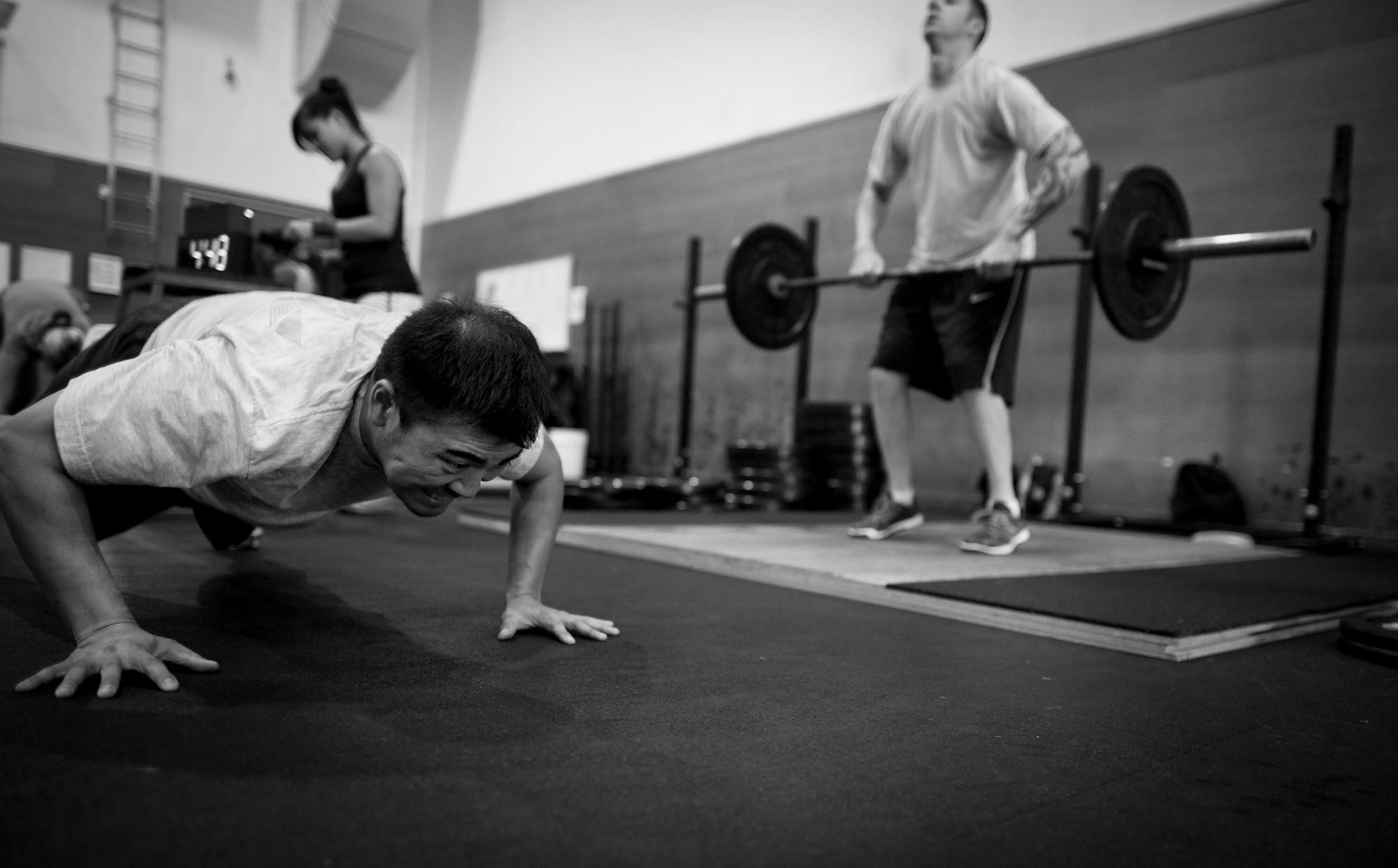 YOKOTA AIR BASE, Japan -- Students participate in the workout of the day during a tactical fitness training class Sept. 11, 2013, held in the Samurai Fitness Center at Yokota Air Base, Japan. Tactical fitness is a CrossFit style type of workout combining strength training and endurance for a well-balanced all over body workout. (U.S. Air Force photo by Staff Sgt. Stacy Moless)       