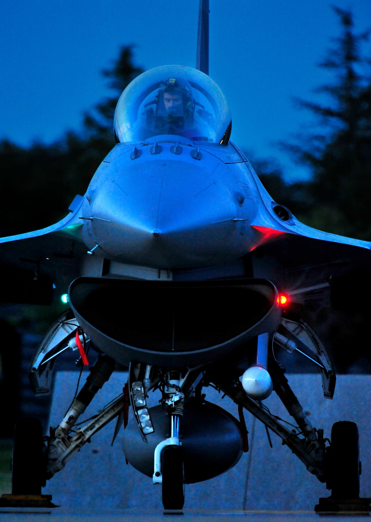 U.S. Air Force Capt. Christopher Charron, 14th Fighter Squadron, prepares for a night flight from Misawa Air Base, Japan, Sept. 9, 2013. Pilots from the 35th Fighter Wing totaled more than 300 flying hours during Iron Spear 13-2, an exercise that tested the F-16’s abilities against the Japan Ground Self-Defense Force’s surface-to-air missile sites. (U.S. Air Force photo by Staff Sgt. Nathan Lipscomb)