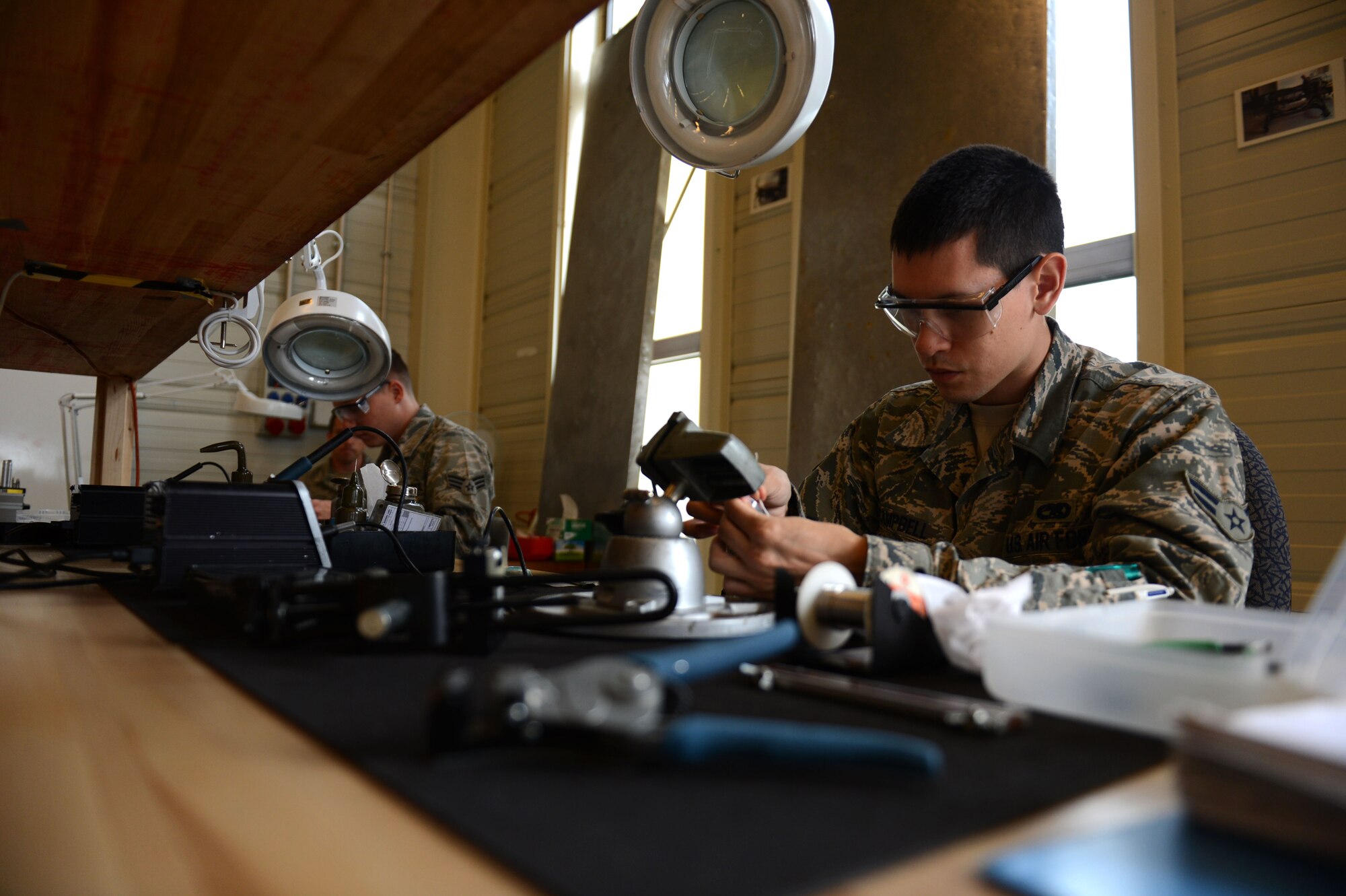 SPANGDAHLEM AIR BASE, Germany – U.S. Air Force Airman 1st Class Enrique Campbell, 52nd Component Maintenance Squadron electronic warfare systems technician from Laredo, Texas, performs soldering techniques during a basic soldering class Sept. 10, 2013. The basic soldering course, led by 372nd Training Squadron instructors, is open to all military card holders. (U.S. Air Force photo by Airman 1st Class Gustavo Castillo/Released) 