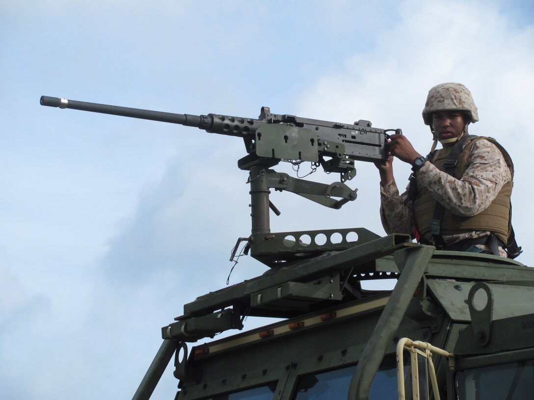 Pfc. Carlton M. Corbin serves as a gunner during the evaluation of the field mess at Camp Kinser during exercise Ulichi Freedom Guardian 2013. UFG is an annual event that is designed to ensure readiness in order to defend the Republic of Korea as well as strengthening the alliance between ROK and U.S. forces by maximizing capabilities between the two forces. Corbin is a food service specialist with Combat Logistics Regiment 37, 3rd Marine Logistics Group, III Marine Expeditionary Force. 