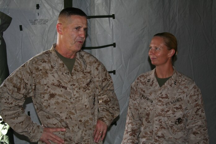Col. Edmund J. Bowen, Left, and Capt. Rebecca L. Wilkinson discuss the success of the field mess Aug. 21, at Camp Kinser during exercise Ulichi Freedom Guardian 2013. Marines from Food Services set up a field mess during the exercise to demonstrate their capabilities in a field environment in the event of combat operations. Bowen is the commanding officer of Combat Logistics Regiment 37, 3rd Marine Logistics Group, III Marine Expeditionary Force. Wilkinson is the commanding officer of Company F, Combat Logistic Battalion 31, CLR-37, 3rd MLG, III MEF. 