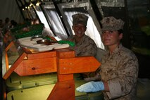 Lance Corporals Ali B. Obermeyer, left, and Hannah E. Srebernak serve food Aug. 21 at Camp Kinser during exercise Ulichi Freedom Guardian 2013. UFG is an annual event that is designed to ensure readiness in order to defend the Republic of Korea as well as strengthening the alliance between ROK and U.S. forces by maximizing capabilities between the two forces. Obermeyer is a motor transport operator with Combat Logistics Battalion 351, Combat Logistics Regiment 35, 3rd Marine Logistics Group, III Marine Expeditionary Force. Srebernak is a supply administration and operations specialist with CLR-35, 3rd MLG, III MEF. 