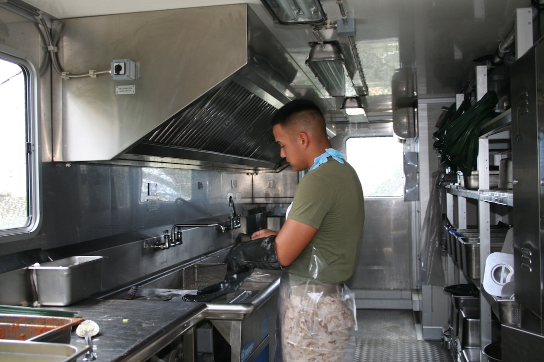 Lance Cpl. Richard L. Trueblood works at a field sanitation unit Aug. 21 at Camp Kinser during exercise Ulichi Freedom Guardian 2013. UFG is an annual event that is designed to ensure readiness in order to defend the Republic of Korea as well as strengthening the alliance between ROK and U.S. forces by maximizing capabilities between the two forces. Trueblood is an engineer equipment operator with Combat Logistics Regiment 35, 3rd Marine Logistics Group, III Marine Expeditionary Force. 