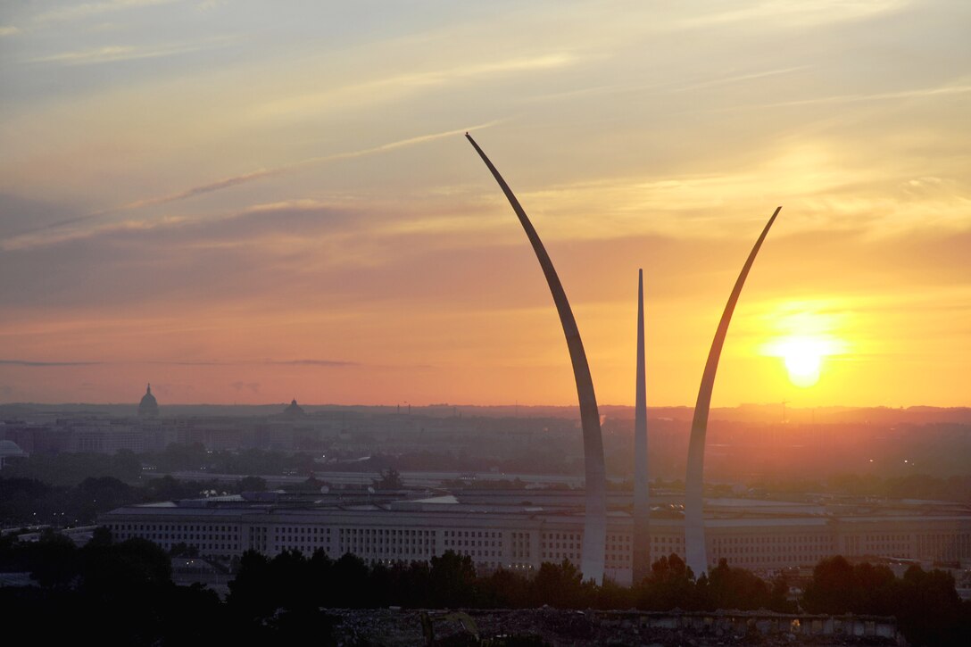 The sun rises behind the Air Force Memorial, the Pentagon, and the Washington, D.C. , skyline in Arlington, Va., Aug. 25, 2013. Since its formal dedication Oct. 14, 2006, the memorial has been a place of pride and honor for all the men and women who served and continue to serve the Air Force and its heritage organizations. (U.S. Air Force photo/Tech. Sgt. Peter R. Miller)