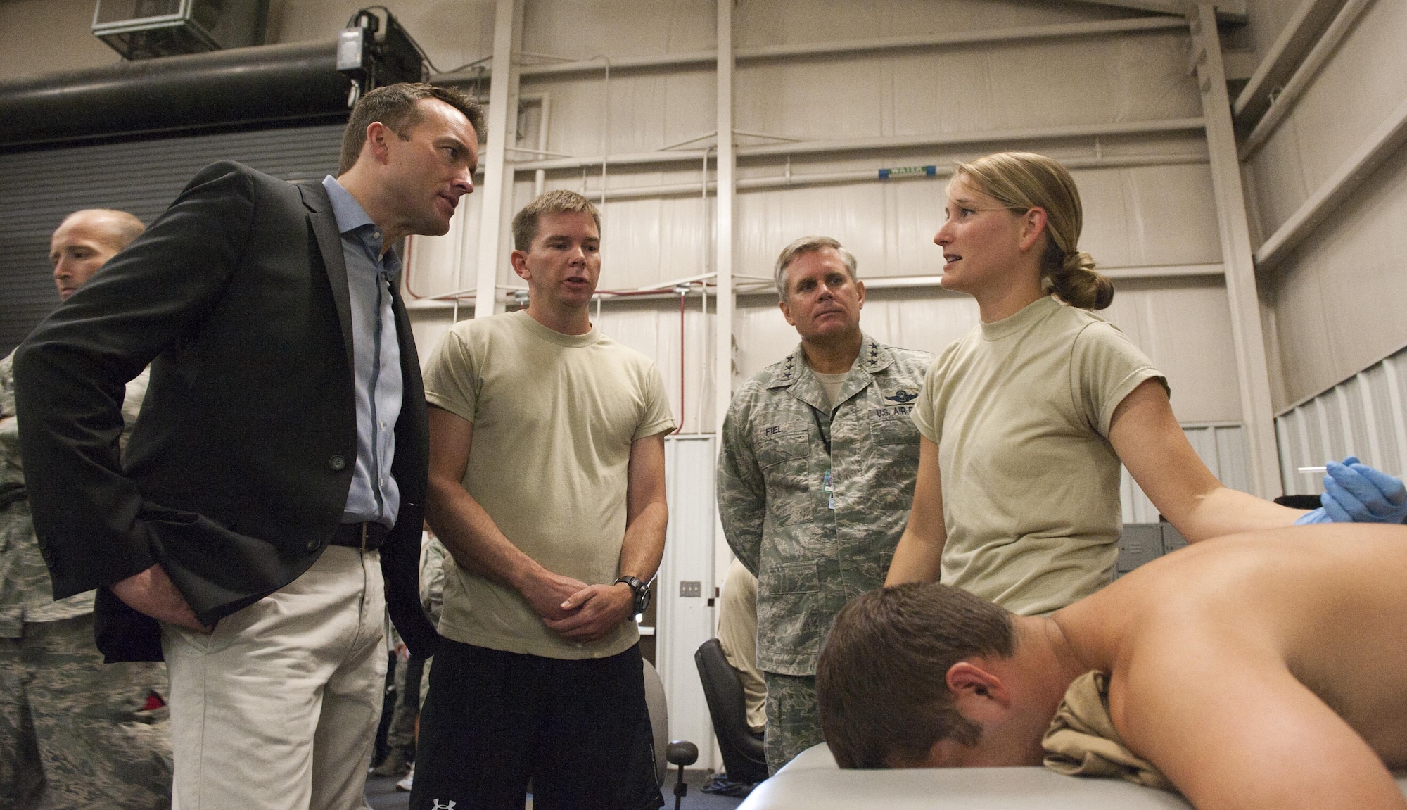 Capt. Danielle Schnitker, 23rd Special Tactics Squadron physical therapist, speaks with Acting Secretary of the Air Force Eric Fanning about physical therapy treatment at Hurlburt Field, Fla., Sept. 10, 2013. This is Fanning’s first visit to the area since he assumed office June 21, 2013. 
