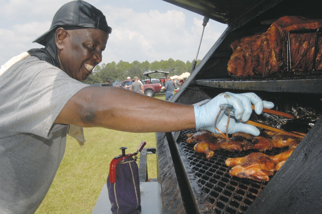 Tyrone Marshall of T Bone Barbeque participates in Marine Corps Community Service's "Amateur" Barbecue Cook-off Aug. 29. Marshall has barbecued every year since the competition began in 2006.