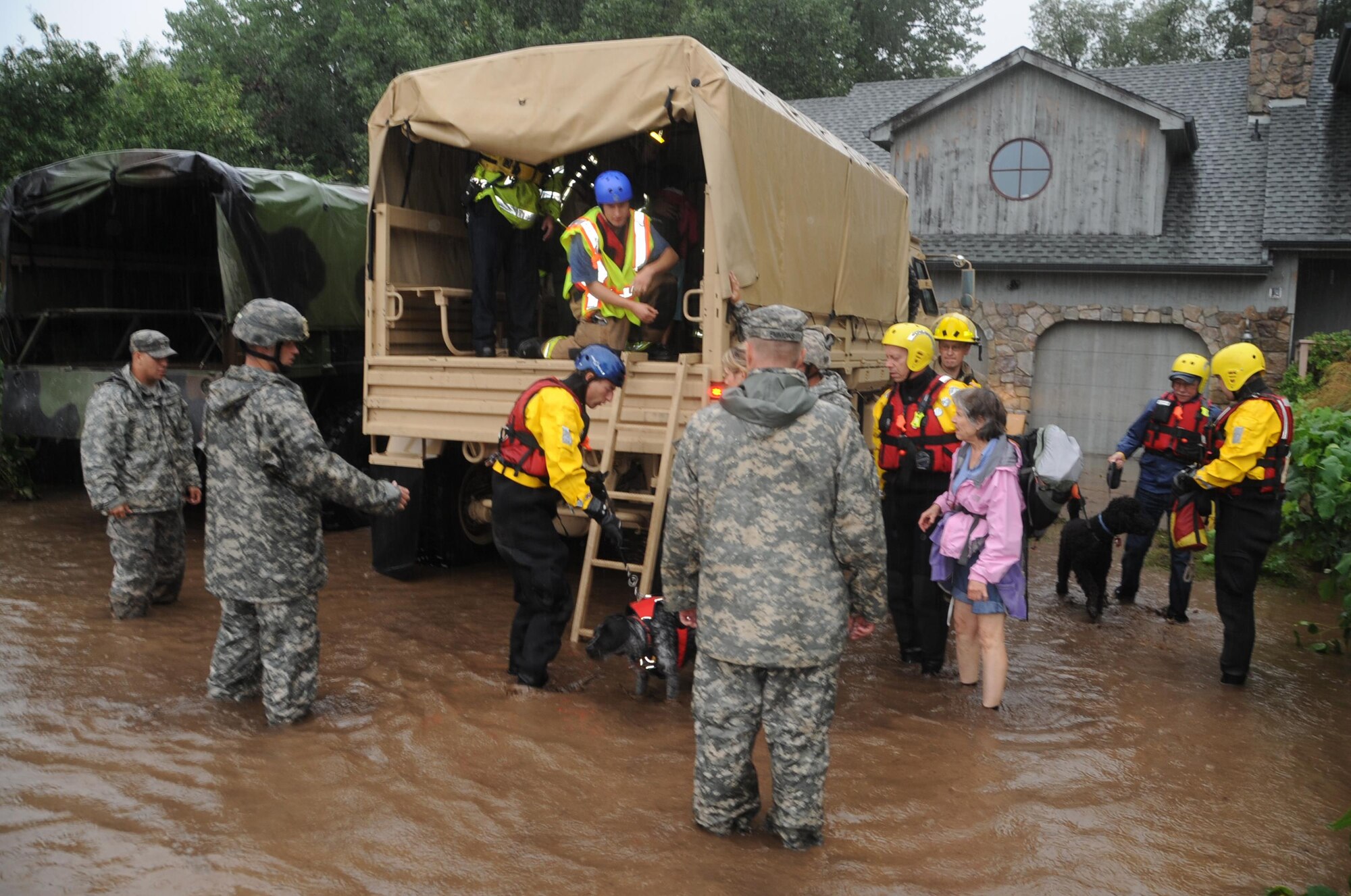 Colorado National Guardsmen respond to floods in Boulder County, Colo., Sept.12, 2013. The guardsmen are working with local agencies to help citizens in the area affected by the flooding by evacuating people using high-clearance vehicles. 