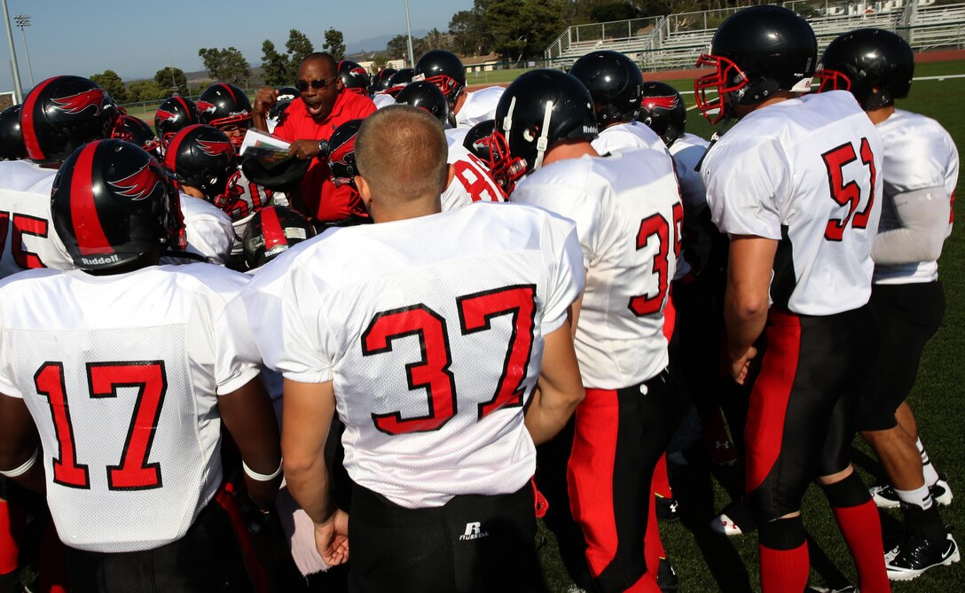 Master GySgt. Carlice Moffett, the Marine Corps Air Station Miramar Falcons' head coach, fires up the players before their third game this season aboard Marine Corps Base Camp Pendleton, Calif., Sept. 10. The Falcons played Pendleton's Headquarters and Support Battalion Spartans ending in a 23-0 score, the Falcons' third victory.