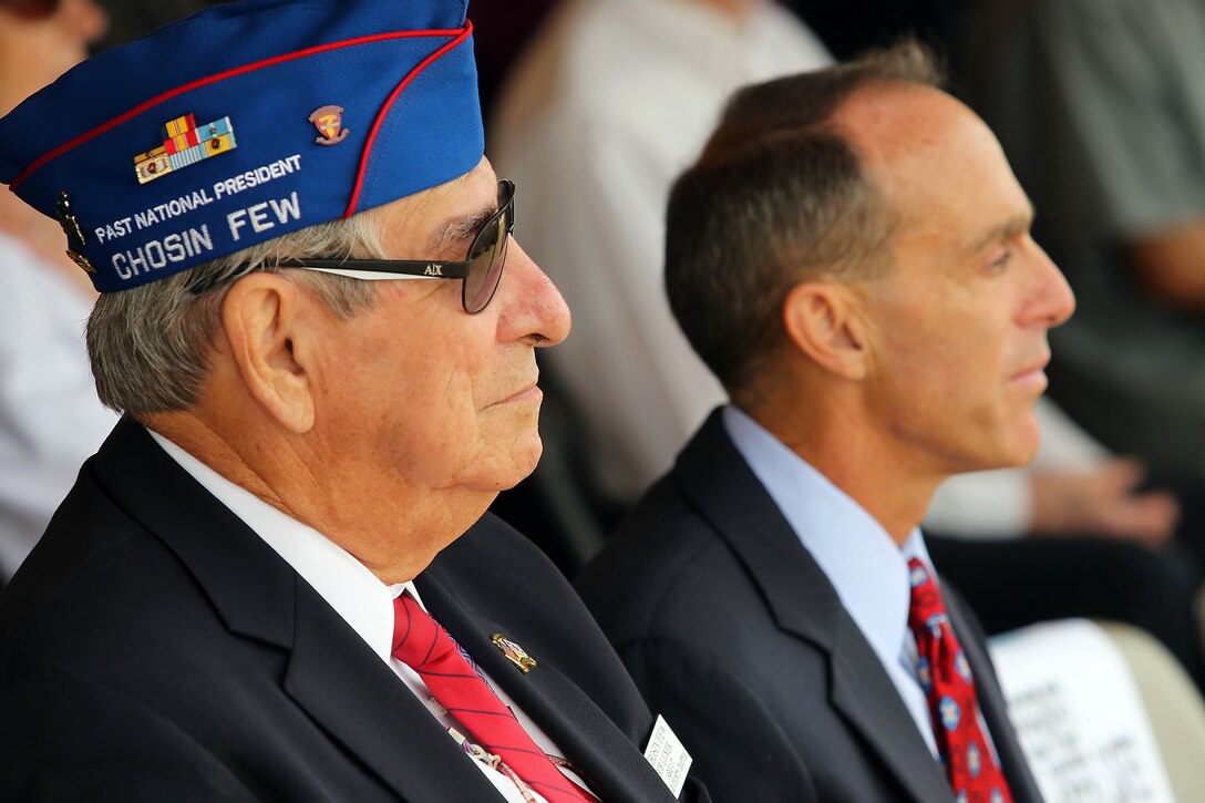 Bob Licker, left, listens to guest speakers during the 63rd Anniversary of the Landing on Inchon at the Chosin Few Monument adjacent to the Pacific Views Event Center here Sept. 13. Licker is a Korean War veteran and was apart of the Chosen Few. The ceremony for the 63rd Anniversary of the Landing on Inchon is also a time to commemorate those who gave their life during the conflict. 
