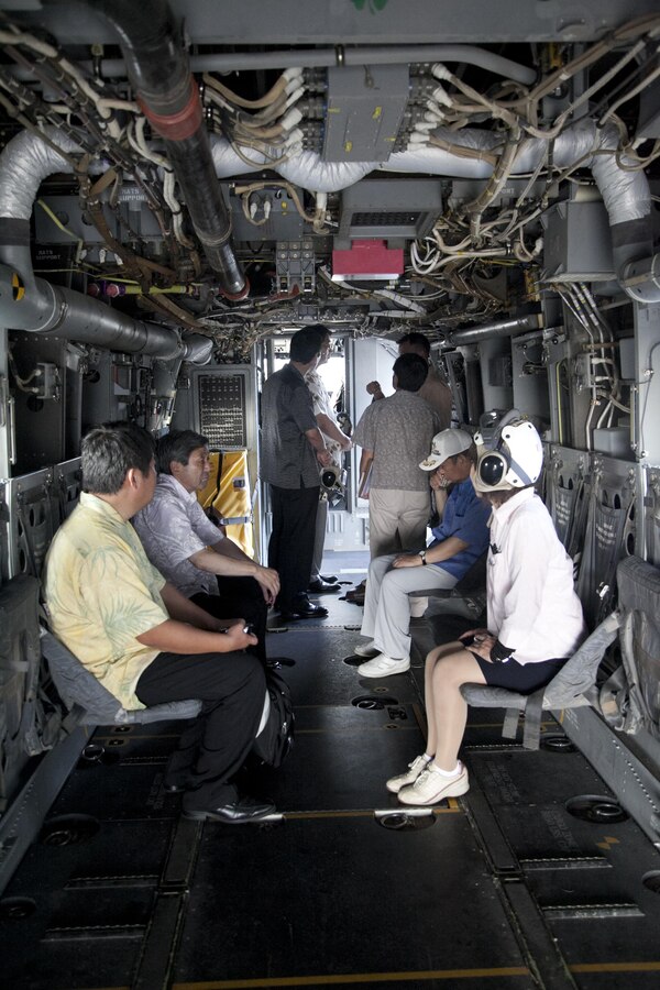 Members of the Liberal Democratic Party of Japan explore the interior of an MV-22B Osprey tiltrotor aircraft Sept. 9 at Marine Corps Air Station Futenma. The delegation learned about the Osprey’s capabilities and pilot training during their visit to the air station. The Osprey is with Marine Medium Tiltrotor Squadron 262, Marine Aircraft Group 36, 1st Marine Aircraft Wing, III Marine Expeditionary Force.