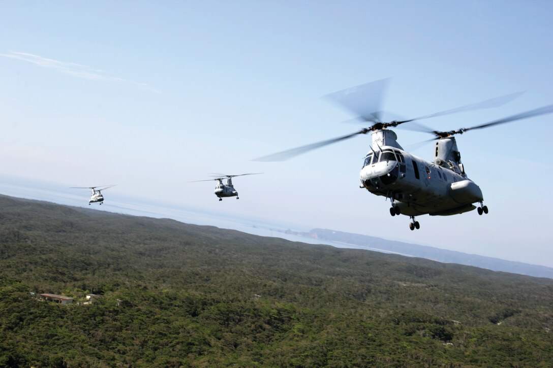 CH-46E Sea Knight helicopters perform a sundown flight over Okinawa Sept. 6 to commemorate the retiring aircraft. Sundown flights are a tradition for retiring aircraft. Marine Medium Tiltrotor Squadron 262 is slated to hold their final flight of CH-46Es Sept. 30, as they fly down to Camp Kinser to be retired. VMM-262 is a part of Marine Aircraft Group 36, 1st Marine Aircraft Wing, III Marine Expeditionary Force. 