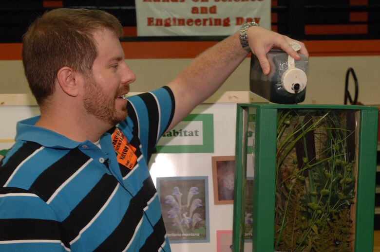 Casey Ehorn, U.S. Army Corps of Engineers Nashville District Regulatory Division project manager, demonstrates how wetlands naturally filter water during Hands-On Science and Engineering Day at Stratford STEM Magnet High School Sept. 12, 2013.