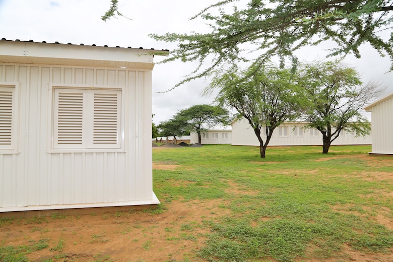 Construction work continues at Dodji Peace Keeping Operations Training Center in Senegal Aug. 20. The camp is being upgraded to include eight new barracks, seen here in white, a dining facility, shower and latrine facilities for men and women, a water treatment plant and a well. Existing barracks remain in the back right. The turnkey facilities will accommodate and supply 1,000 soldiers upon completion mid-September. U.S. Department of State Global Peace Operations Initiative funded the project to support the development of Senegalese PKO capabilities.