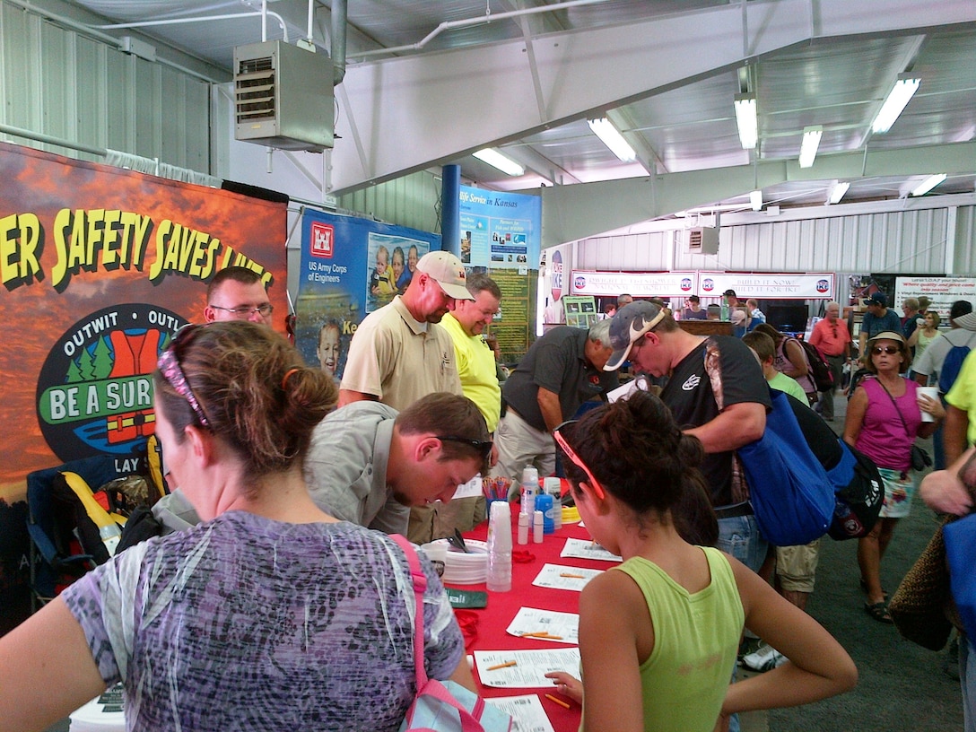 USACE water safety booth staff interact with visitors at the Kansas State Fair. The booth won the “reserve grand champion” ribbon for the caliber of appearance of the booth and the staff, and the value it provides to fair visitors.