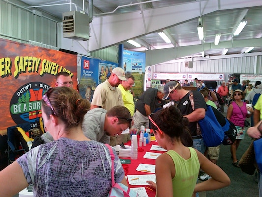 USACE water safety booth staff interact with visitors at the Kansas State Fair. The booth won the “reserve grand champion” ribbon for the caliber of appearance of the booth and the staff, and the value it provides to fair visitors.