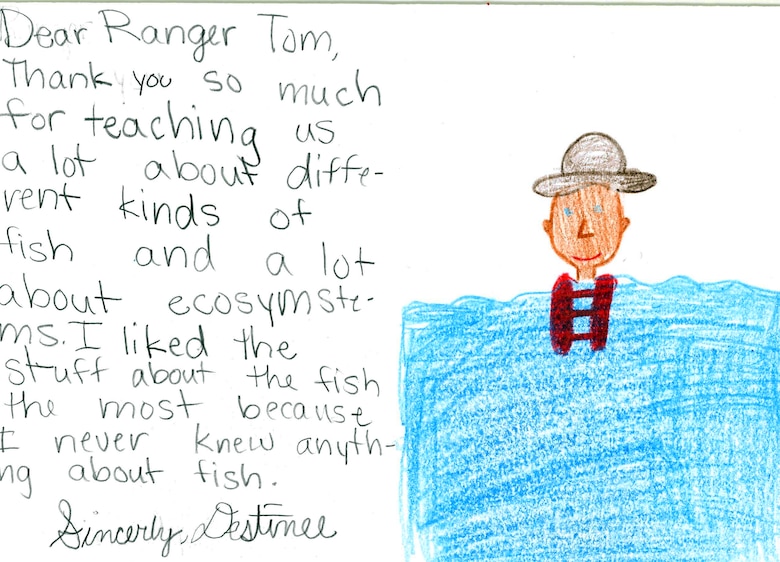 Ranger Tom appears to be swimming nicely while wearing his life jacket and uniform hat.