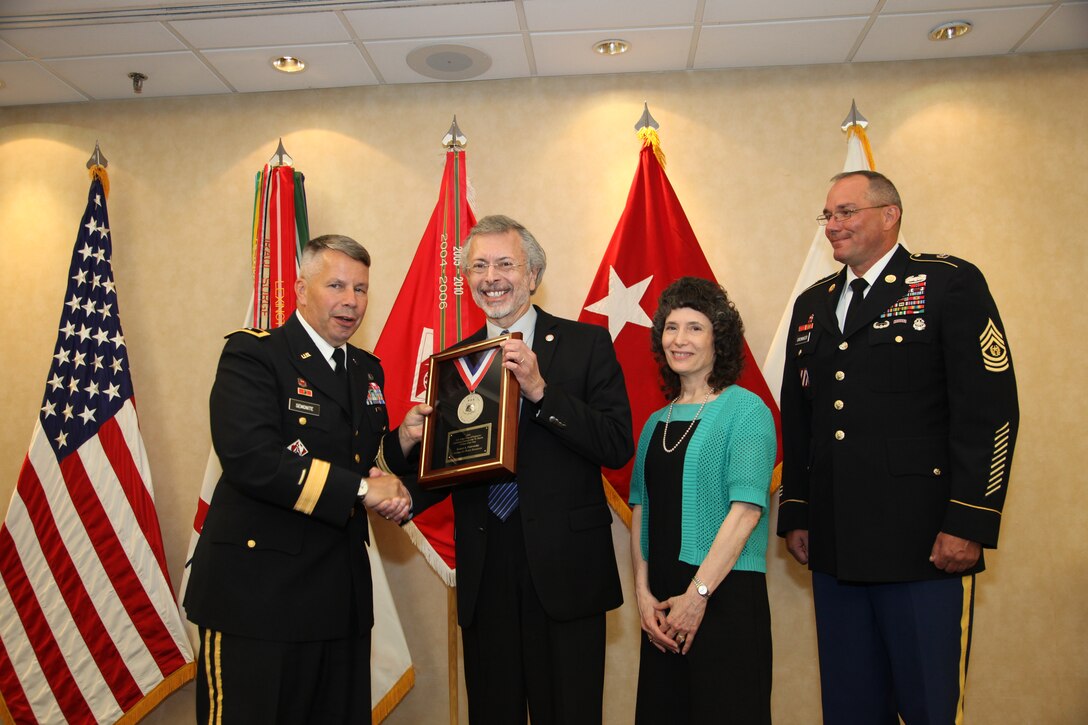 IWR and ICIWaRM Director Robert Pietrowsky accepts the 2013 LTG John W. Morris Civilian of the Year Award at the National Awards Dinner. Left to right: Major General Todd T. Semonite, Robert A. Pietrowsky, Camille Torquato, Command Sergeant Major Karl J. Groninger