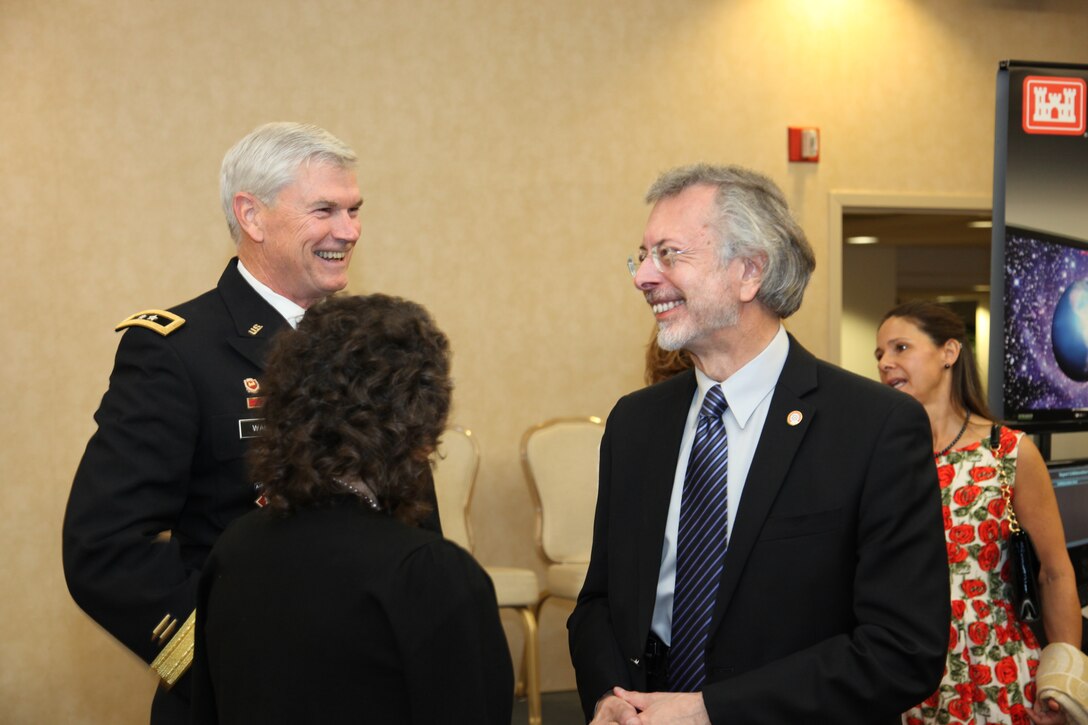 Major General Michael J. Walsh (left) speaks to IWR and ICIWaRM Director Robert Pietrowsky (right) and Camille Torquato (center) at the National Awards Dinner.