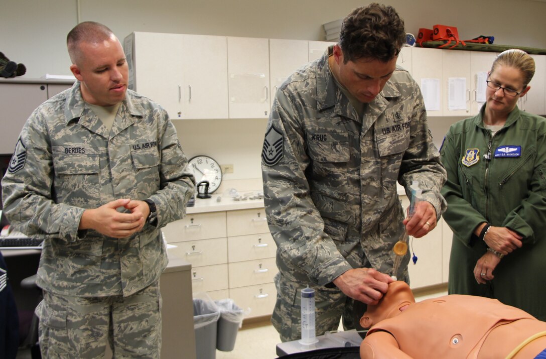 Master Sgt. Matthew Gerdes of 932nd Airlift Wing Medical Squadron instructs Master Sgt. Riley Krug on how to properly insert a airway adjunct on a patient.  The members of MDS underwent Emergency Medical Technican training this week at Scott Air Force Base.