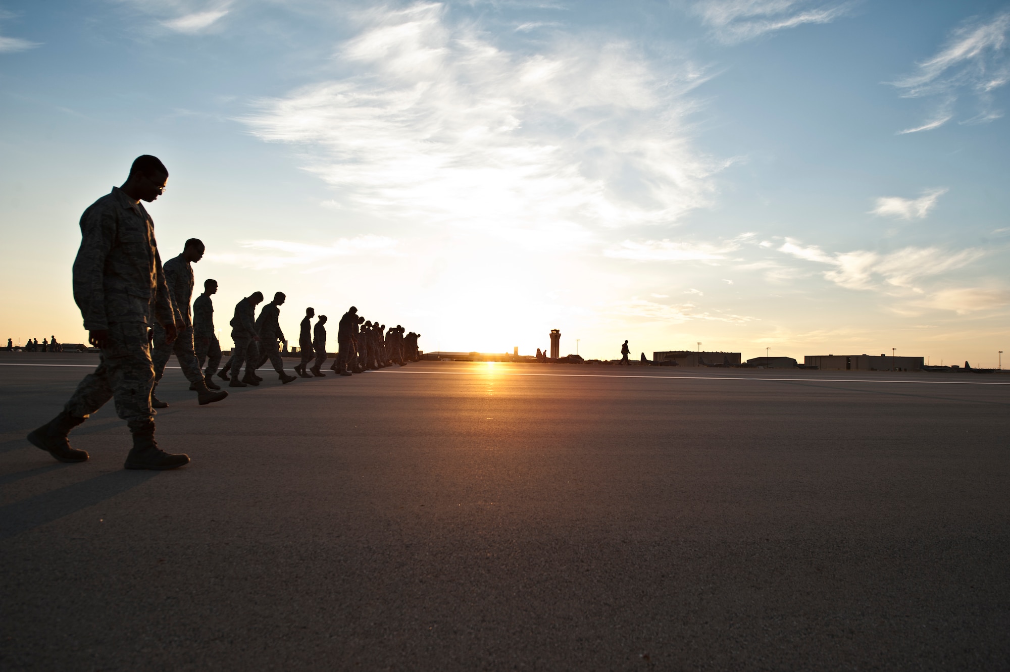 Dyess Airmen conduct a Foreign Object Debris (FOD) walk down the flightline Sept. 9, 2013, at Dyess Air Force Base, Texas. On Aug. 29, Dyess reached a new pinnacle of FOD prevention; 1,500 days without a chargeable FOD incident. FOD is considered a substance, debris or article alien to a vehicle or system which can cause significant damage to an aircraft. (U.S. Air Force photo by Staff Sgt. Richard Ebensberger/Released)