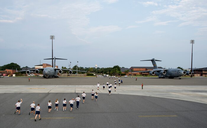 Members of Team Charleston participate in the "Run the Runway 5k" Sept. 13, 2013 at Joint Base Charleston, S.C. This was the first time that "Run the Runway" was used as a commander's challenge and the run brought in over 700 Joint Charleston participants. The event was held to celebrate the delivery of the last U.S. Air Force C-17 to Joint Base Charleston. (U.S. Air Force photo/Tech. Sgt. Rasheen Douglas)
