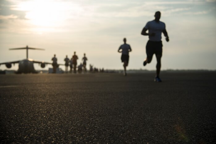Members of Team Charleston participate in the "Run the Runway 5k" Sept. 13, 2013 at Joint Base Charleston, S.C. This was the first time that "Run the Runway" was used as a commander's challenge and the run brought in over 700 Joint Charleston participants. The event was held to celebrate the delivery of the last U.S. Air Force C-17 to Joint Base Charleston. (U.S. Air Force photo/Tech. Sgt. Rasheen Douglas)
