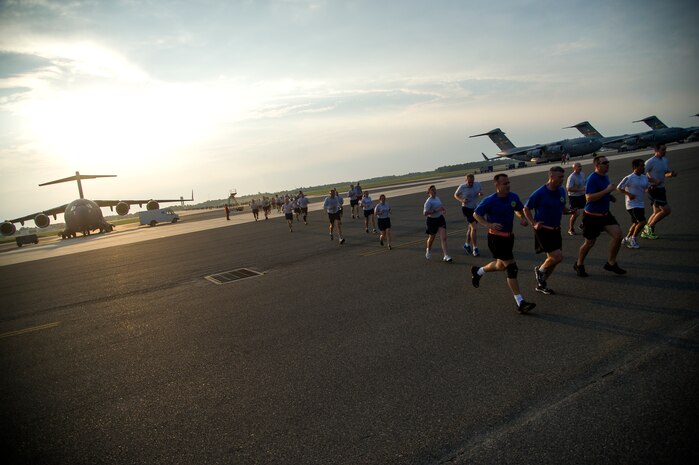 Members of Team Charleston participate in the "Run the Runway 5k" Sept. 13, 2013 at Joint Base Charleston, S.C. This was the first time that "Run the Runway" was used as a commander's challenge and the run brought in over 700 Joint Charleston participants. The event was held to celebrate the delivery of the last U.S. Air Force C-17 to Joint Base Charleston.  (U.S. Air Force photo/Tech. Sgt. Rasheen Douglas)