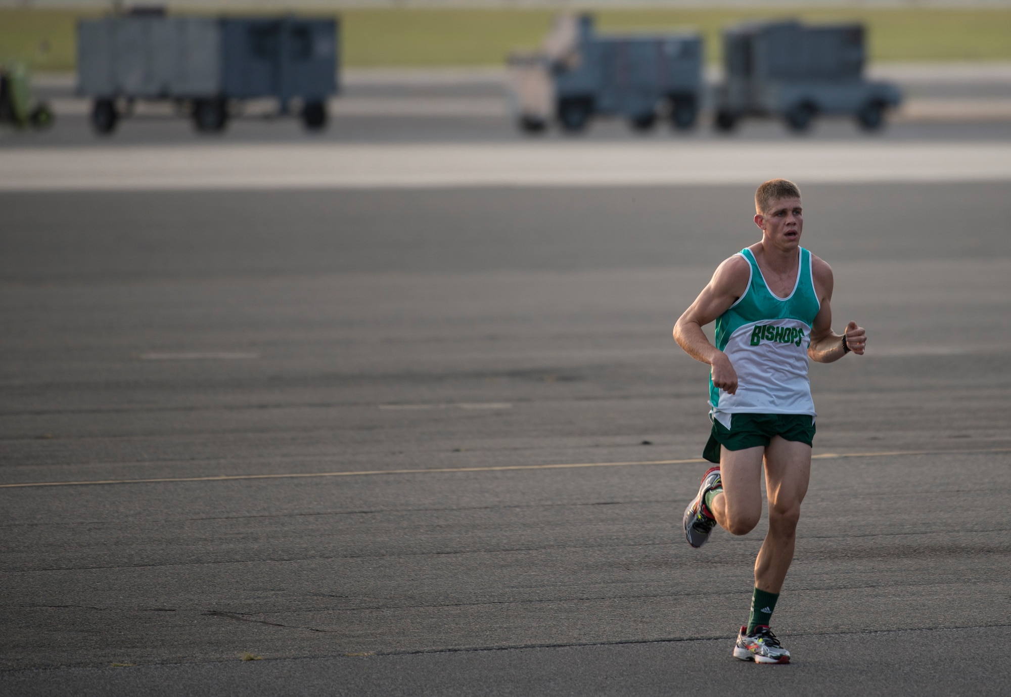 Ensign Matthew DeVillers, Navy Nuclear Power Training Command, runs on the flight line during the “Run the Runway 5k” Sept. 13, 2013, at Joint Base Charleston – Air Base, S.C. This was the first time that "Run the Runway" was used as a commander's challenge and the run brought in over 700 Joint Charleston participants. The event was held to celebrate the delivery of the last U.S. Air Force C-17 to Joint Base Charleston. (U.S. Air Force photo/Tech. Sgt. Rasheen Douglas)