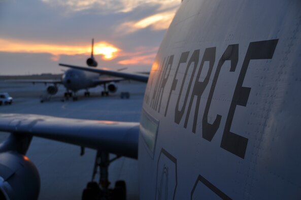 The sun rises over a KC-10 Extender Sept. 11 on the Travis flightline. A 22-aircraft "freedom launch" took place at Travis AFB, Calif., Sept. 11, 2013. Seven C-17 Globemaster IIIs, 11 KC-10 Extenders and four C-5B Galaxies from the 60th Air Mobility Wing launched consecutively over 36 minutes to take part in Air Mobility Command missions. The first plane in the lineup, a C-17, launched at 8:46 a.m., the same time terrorists crashed American Airlines Flight 11 into the North Tower of the World Trade Center in New York City 12 years earlier. (U.S. Air Force photo/Senior Airman Madelyn Brown) 
