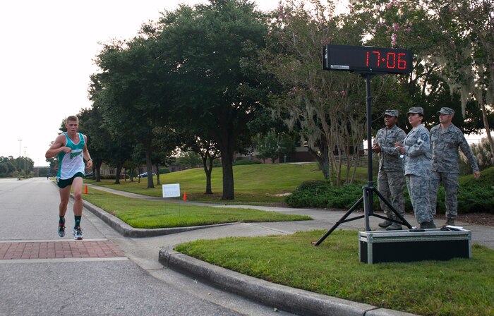 Ensign Matthew DeVillers, Navy Nuclear Power Training Command, is the first male to cross the finish line in 17:06 during the "Run the Runway 5k" Sept. 13, 2013 at Joint Base Charleston, S.C. This is the first time that "Run the Runway" was used as a commander's challenge and the run brought in over 700 Joint Base Charleston participants. (U.S. Air Force photo/Senior Airman Ashlee Galloway)