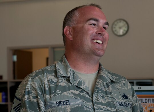 U.S. Air Force Master Sgt. Kelly Riedel, 366th Medical Group first sergeant, smiles for a photo, Aug 20, 2013 at Mountain Home Air Force Base, Idaho. Riedel has been a first sergeant for a year now, reassuring Airmen he is there for them in times of need. (U.S. Air Force photo by Airman 1st Class Brittany Chase/Released)