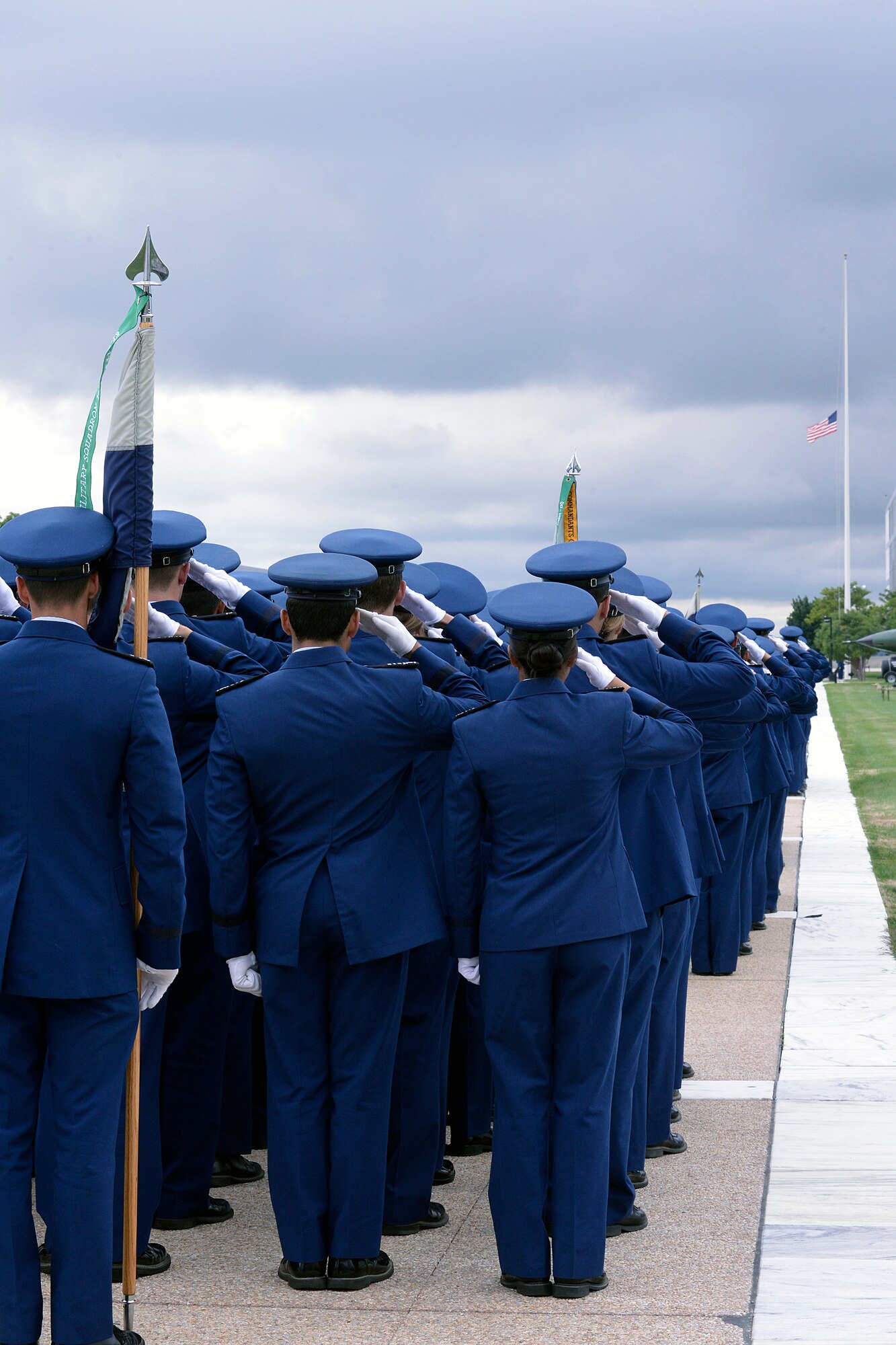 Academy cadets salute the U.S. Flag, flying at half-staff on the Terrazzo, during the 9/11 Memorial Ceremony Wednesday. (U.S. Air Force Photo/Mike Kaplan)
