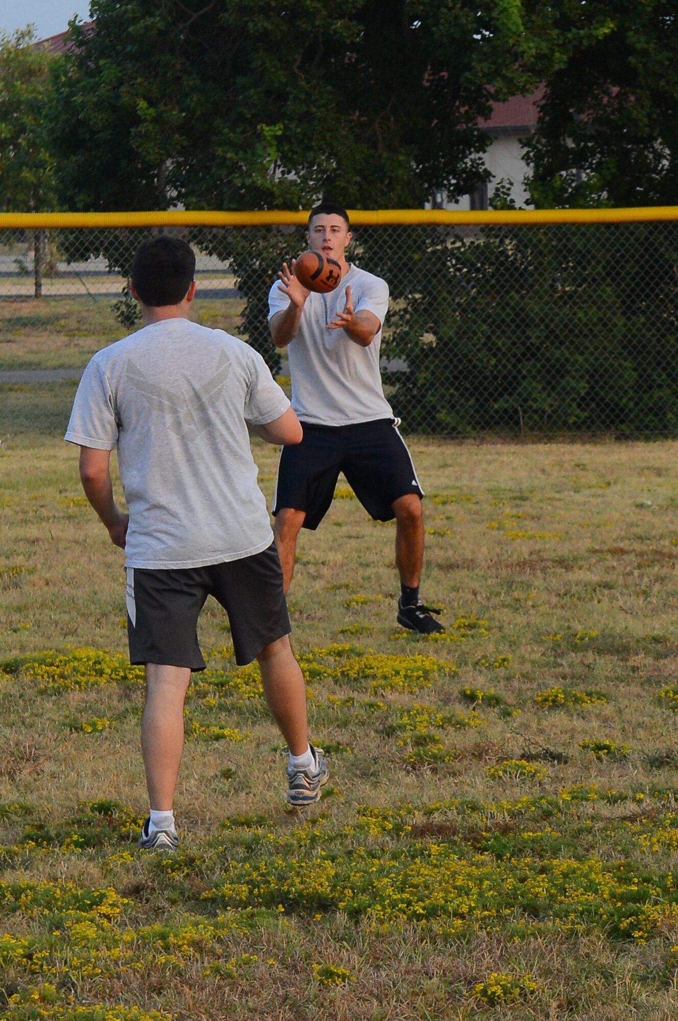 Airman 1st Class Jesse Bozzella, 2nd Contracting Squadron contracting specialist, catches a football on Barksdale Air Force Base, La., Sept. 13, 2013. The Airmen played ultimate football to get to know each other better, build morale, and improve teamwork. (U.S. Air Force photo/Senior Airman Micaiah Anthony)
