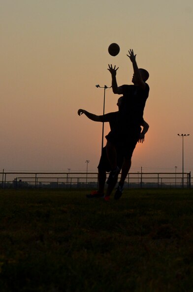 Senior Airman Daniel Speed, 2nd Contracting Squadron contracting specialist, jumps to catch a football on Barksdale Air Force Base, La., Sept. 13, 2013. Airmen from the 2nd CONS played ultimate football to boost unit cohesion as a part of Wingman Week. (U.S. Air Force photo/Senior Airman Micaiah Anthony)