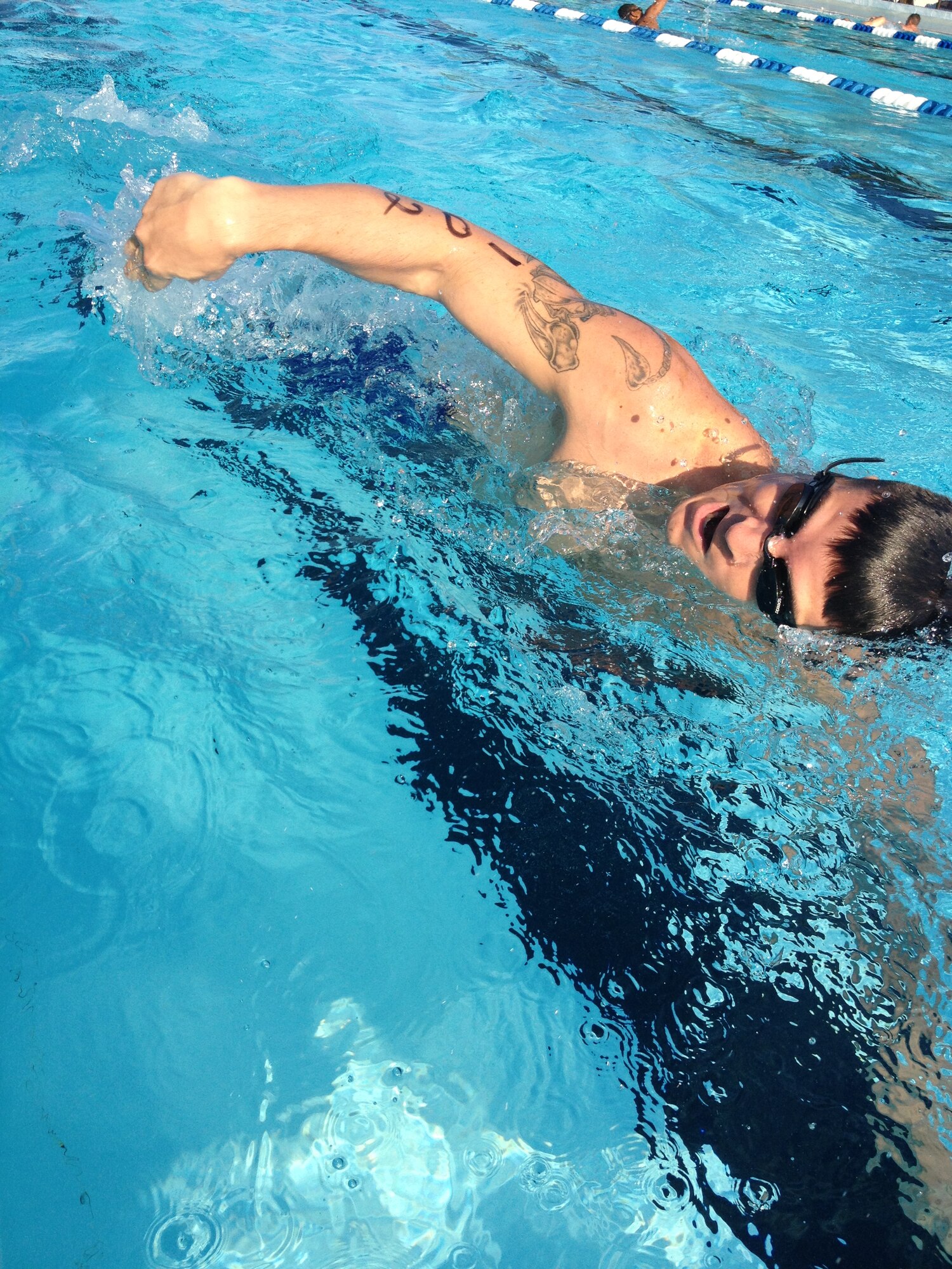 Joshua Palileo, 338th Training Squadron, participates in the 200-yard swim during Keesler's mini-triathlon Sept. 13, 2013, at Keesler Air Force Base, Miss.  The event also included a 9-mile bike ride and a 2-mile run.  (Courtesy photo)