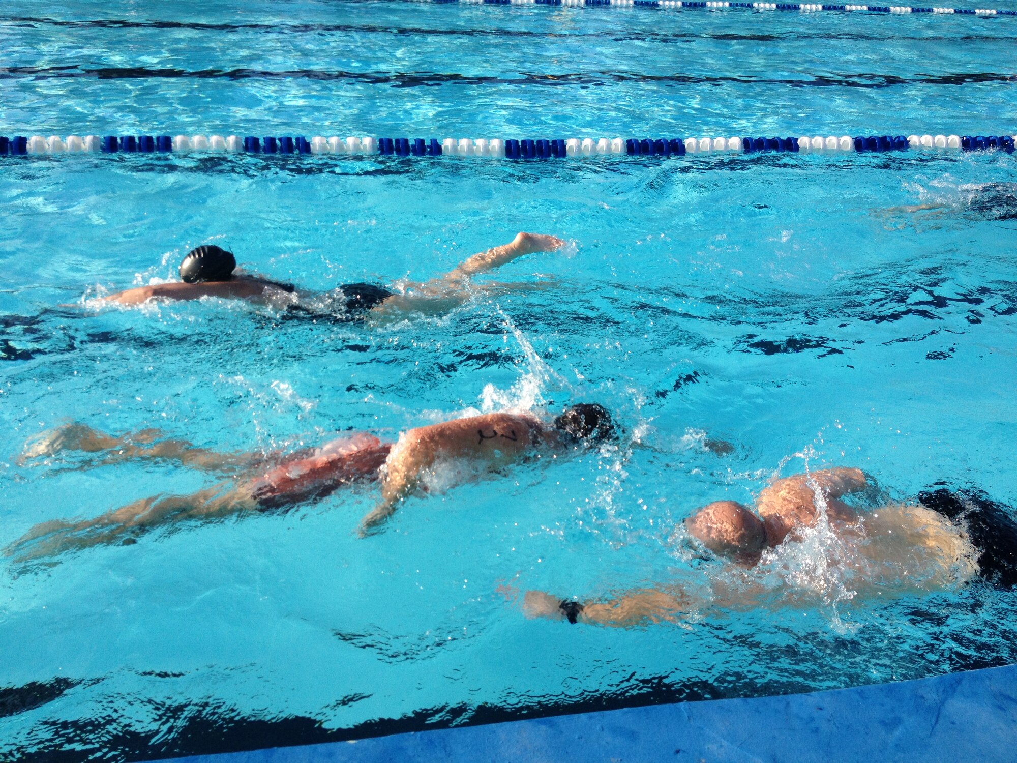 Competitors participate in the 200-yard swim during Keesler's mini-triathlon Sept. 13, 2013, at Keesler Air Force Base, Miss.  The event also included a 9-mile bike ride and a 2-mile run.  (Courtesy photo)