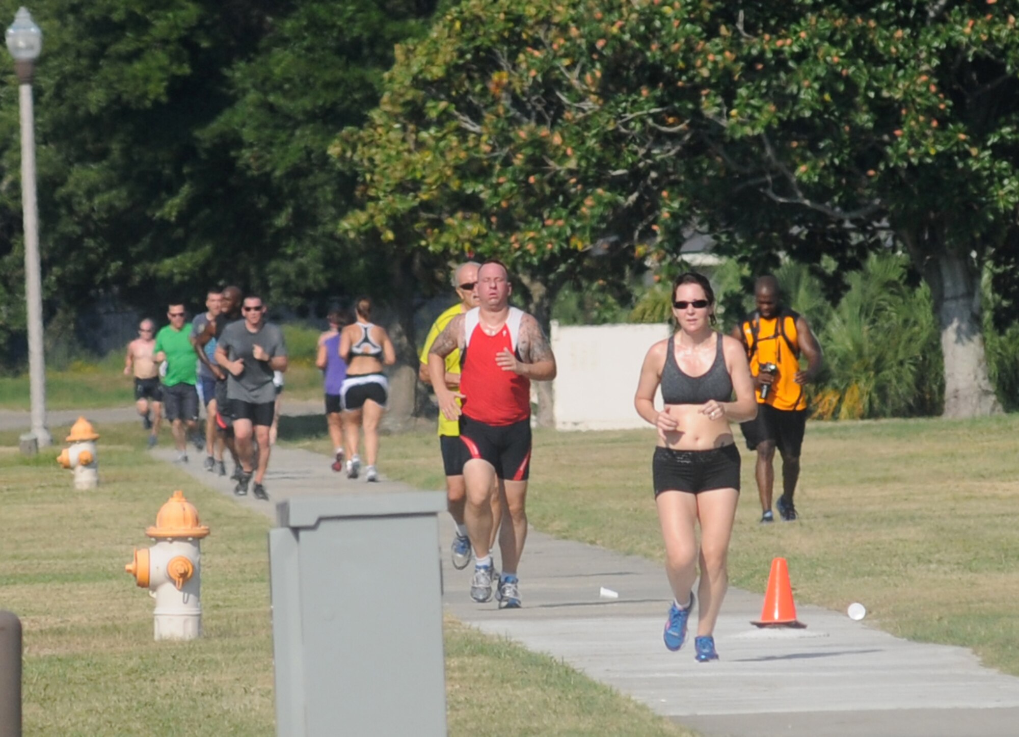 Competitors run the last stretch of the 2-mile run, the final event of Keesler's mini-triathlon Sept. 13, 2013, at Keesler Air Force Base, Miss.  The event also included a 9-mile bike ride and a 200-yard swim.  (U.S. Air Force photo by Kemberly Groue)