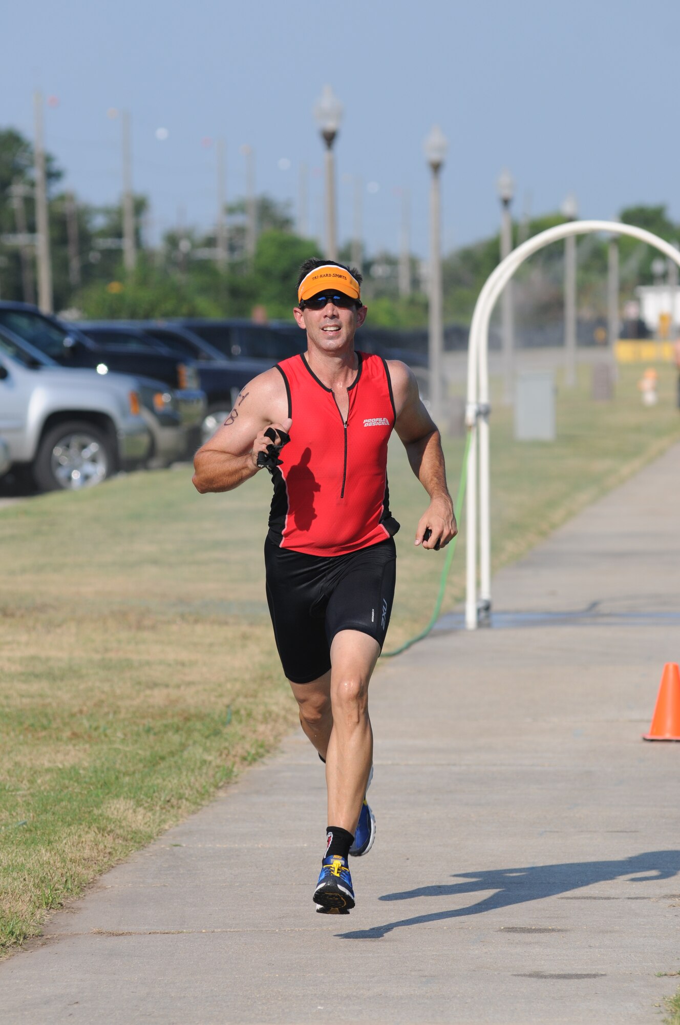 Joel Elliott, 81st Surgical Operations Squadron, nears the finish line as he completes the 2-mile run, the final event of Keesler's mini-triathlon Sept. 13, 2013, at Keesler Air Force Base, Miss.  The event also included a 9-mile bike ride and a 200-yard swim.  (U.S. Air Force photo by Kemberly Groue)