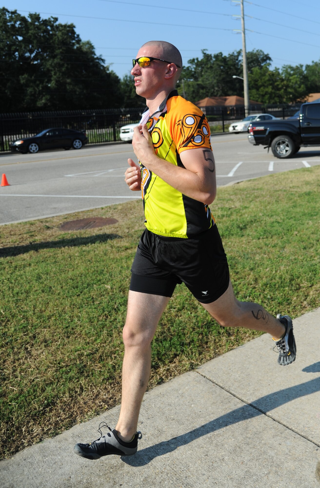 Andrew Haynes, 335th Training Squadron, nears the finish line as he completes the 2-mile run, the final event of Keesler's mini-triathlon Sept. 13, 2013, at Keesler Air Force Base, Miss.  The event also included a 9-mile bike ride and a 200-yard swim.  (U.S. Air Force photo by Kemberly Groue)