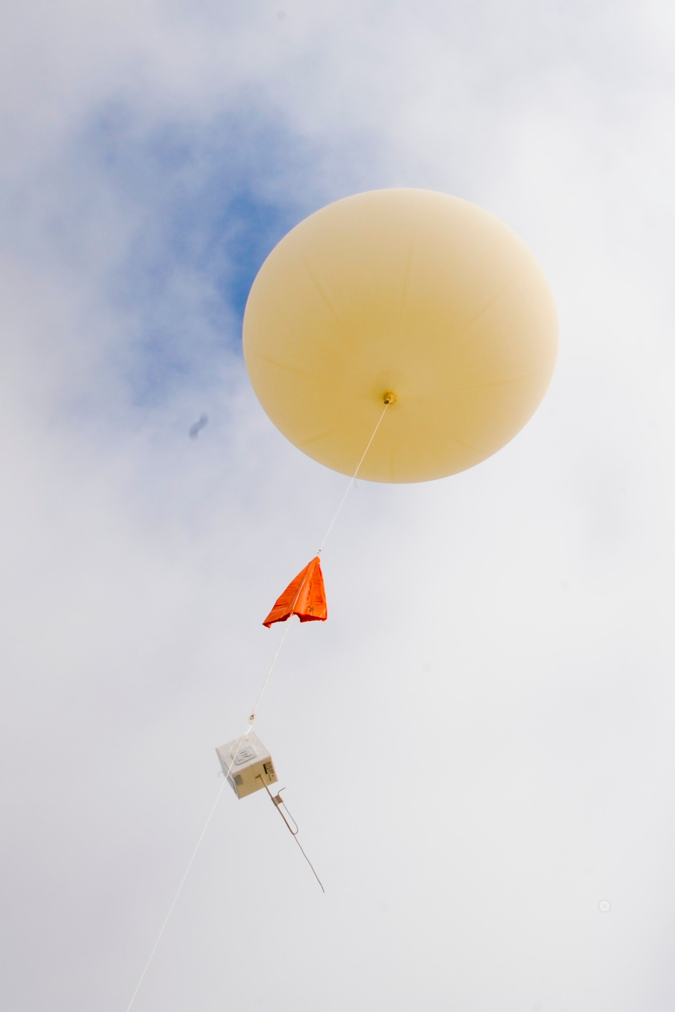 VANDENBERG AIR FORCE BASE, Calif. – A helium filled balloon is released into the atmosphere here Monday, Sept. 9, 2013. A weather or sounding balloon is a balloon which carries instruments aloft to send back information on atmospheric pressure, temperature, humidity and wind speed by means of a small, expendable measuring device called a radiosonde. (U.S. Air Force photo/Airman Yvonne Morales)