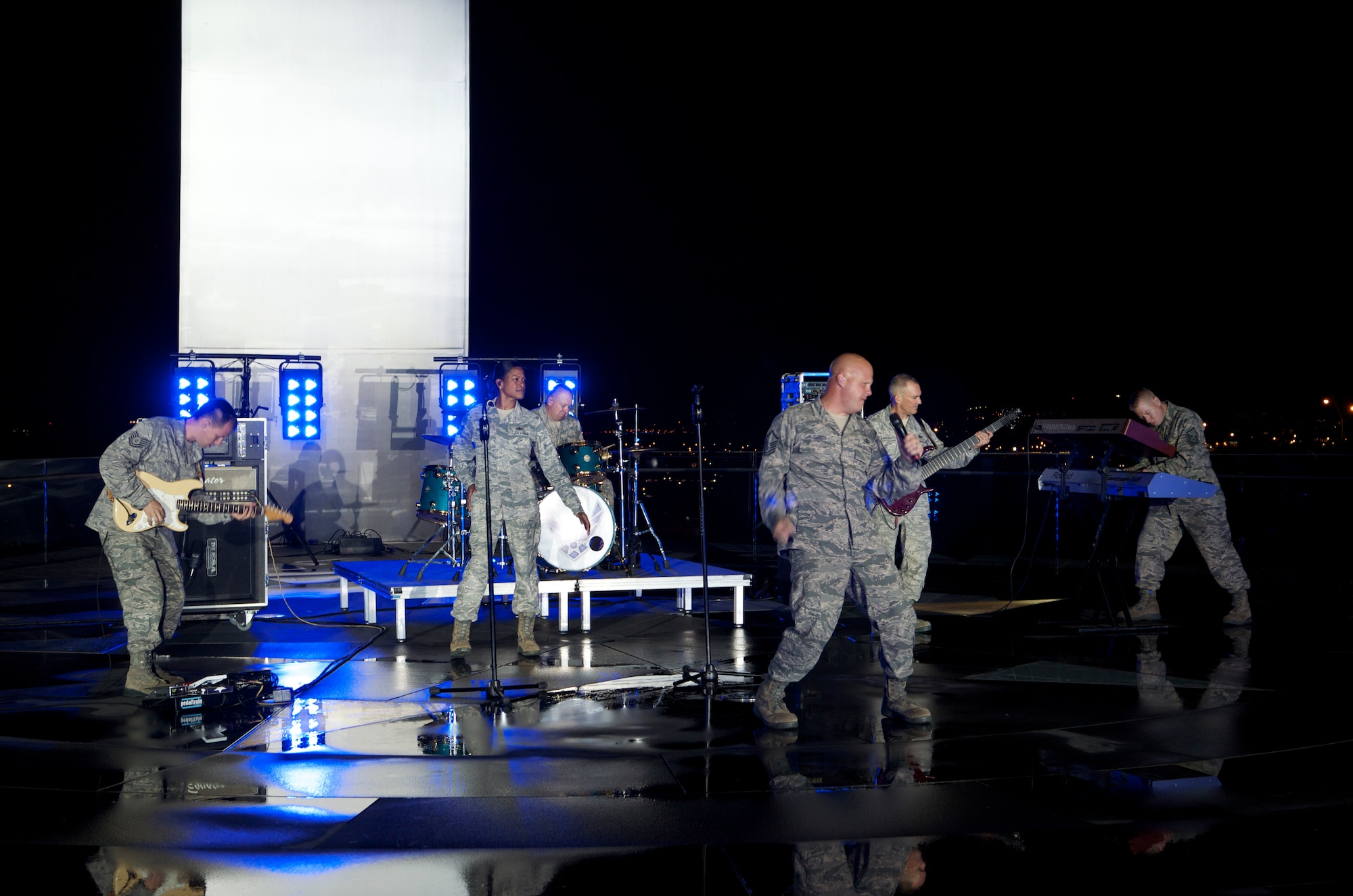 Members of Max Impact on location at a video shoot of their new song, "Stand." (U.S. Air Force photo/Senior Master Sgt. Robert Kamholz)
