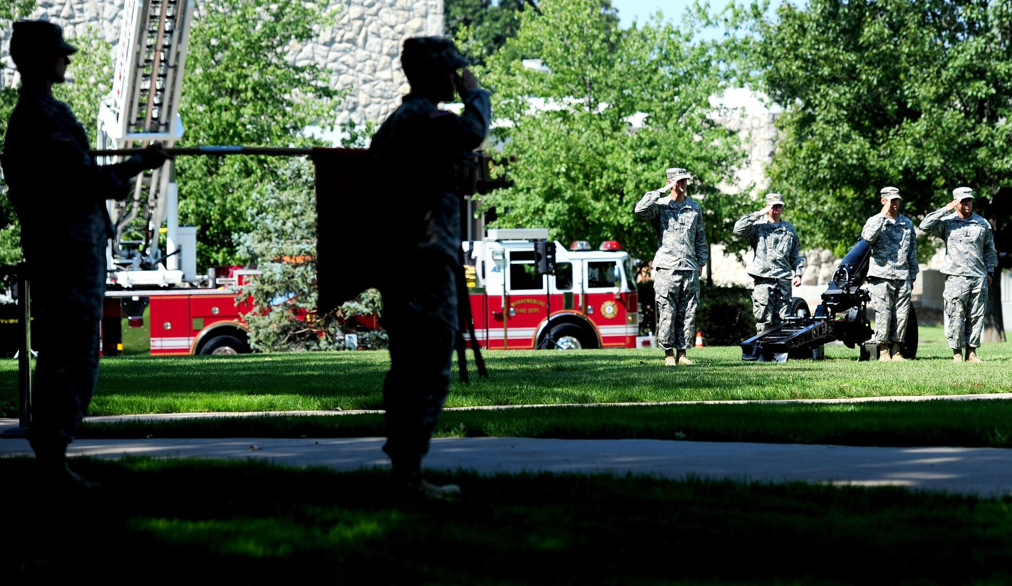 U.S. Army Reserve Officer Training Corps present arms while the American flag is lowered to half-staff during a 9/11 Memorial Ceremony at the University of Central Missouri in Warrensburg, Mo., Sept. 11, 2013. More than 2,800 people from over 90 countries around the world were victims to the 9/11 terrorist attacks. (U.S. Air Force photo by Staff Sgt. Nick Wilson/Released)