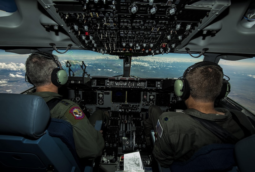 General Paul Selva, Air Mobility Command commander, takes control of C-17 Globemaster III, P-223, mid-flight during the inaugural flight of the final U.S. Air Force C-17 Sept. 12, 2013. Lt. Gen. James Jackson, Air Force Reserve commander, performed the take-off from California and Lt. Gen. Stanley Clarke, Air National Guard director, landed the aircraft at Joint Base Charleston, S.C. This historical event comes more than 20 years after the 437th Airlift Wing and the 315th Airlift Wing took delivery of the very first C-17 to enter the Air Force inventory June 14, 1993 and marks the successful completion of C-17 production for the U.S. Air Force. (U.S. Air Force photo/ Senior Airman Dennis Sloan)